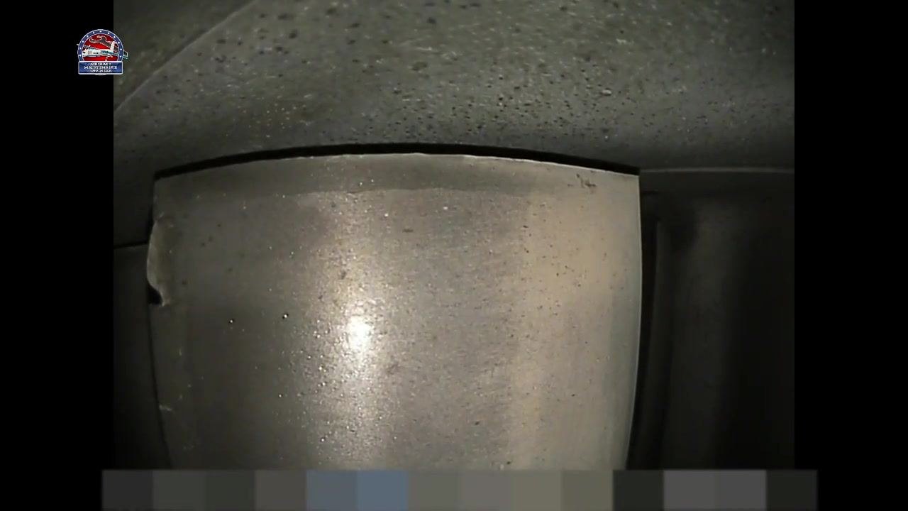 Metallic component with the previously identified chip and crack still visible