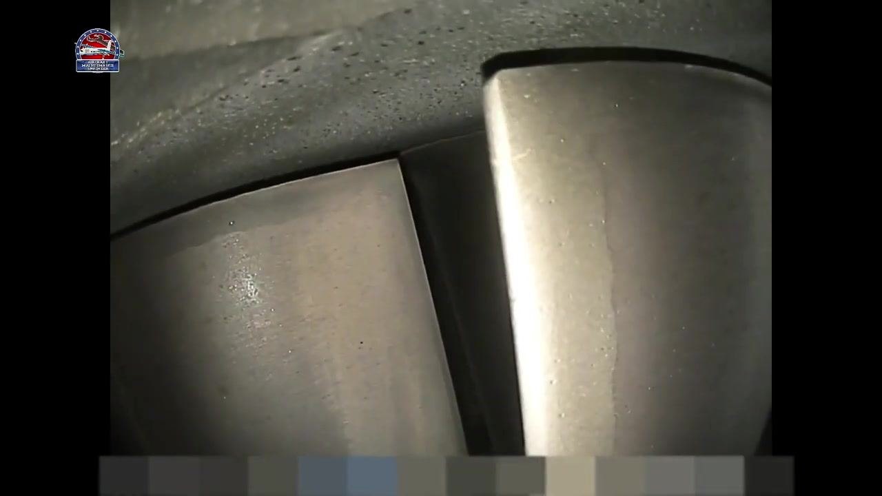 Two adjacent turbine blades with smooth metallic surfaces and no visible cracks or chips