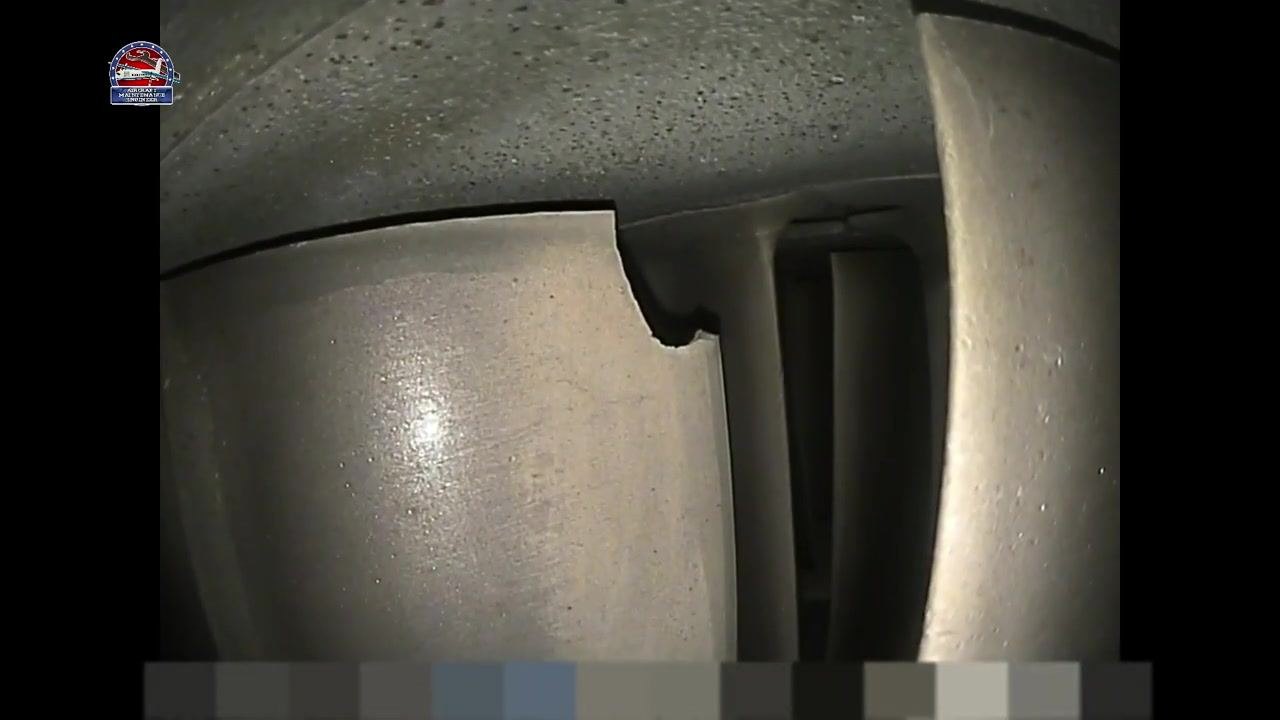 Turbine blade with a large, irregular chip or missing section on the upper edge