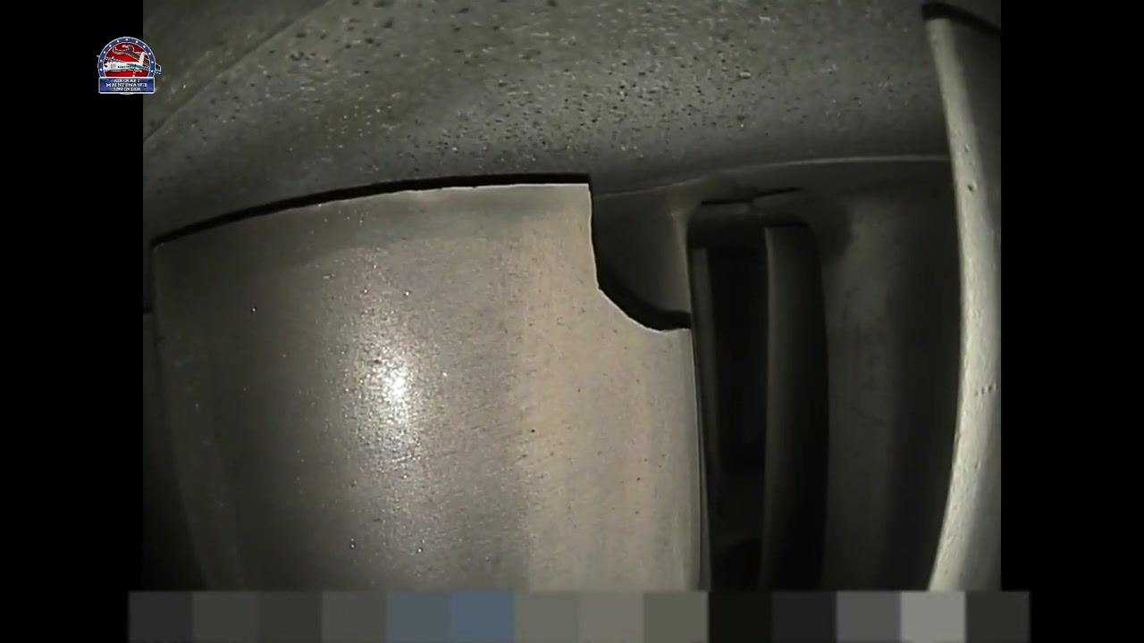 Turbine blade damage viewed from a slightly different angle, showing depth and width more clearly