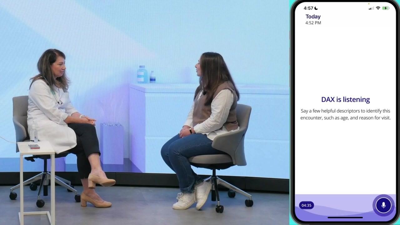 Provider and patient concluding the consultation, with the DAX app still listening and recording