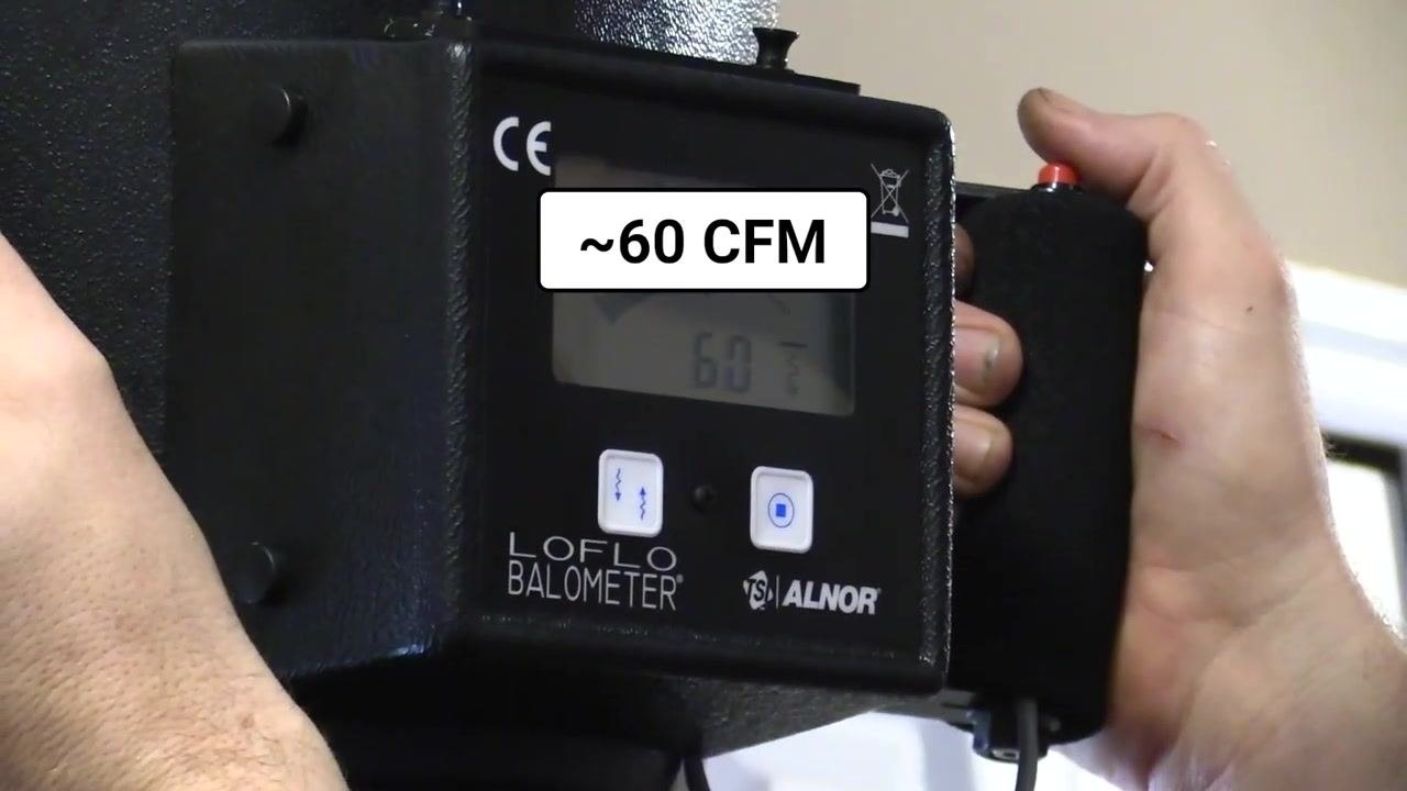 Close-up of the flow hood display showing a reading of 60 CFM.