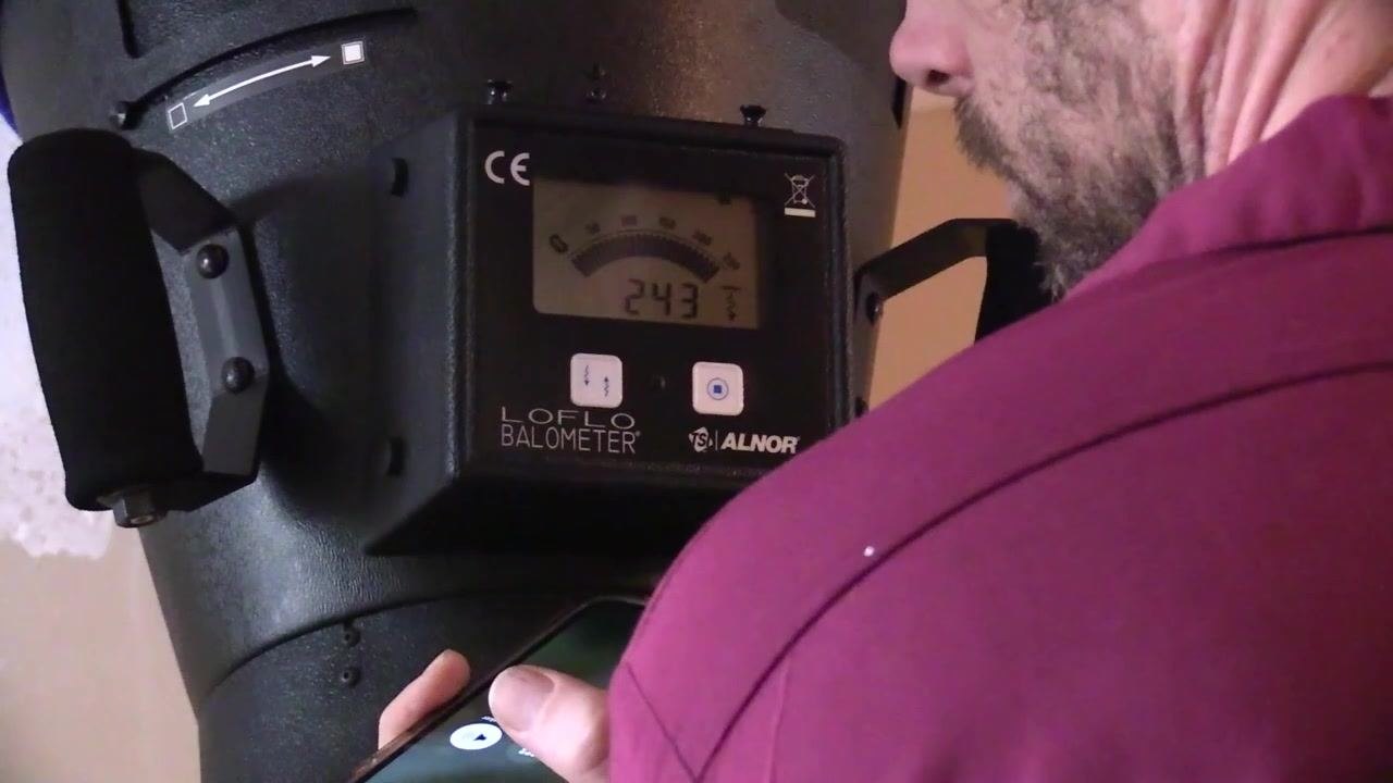 Close-up of the flow hood display showing a reading of 236 CFM after a fine adjustment.