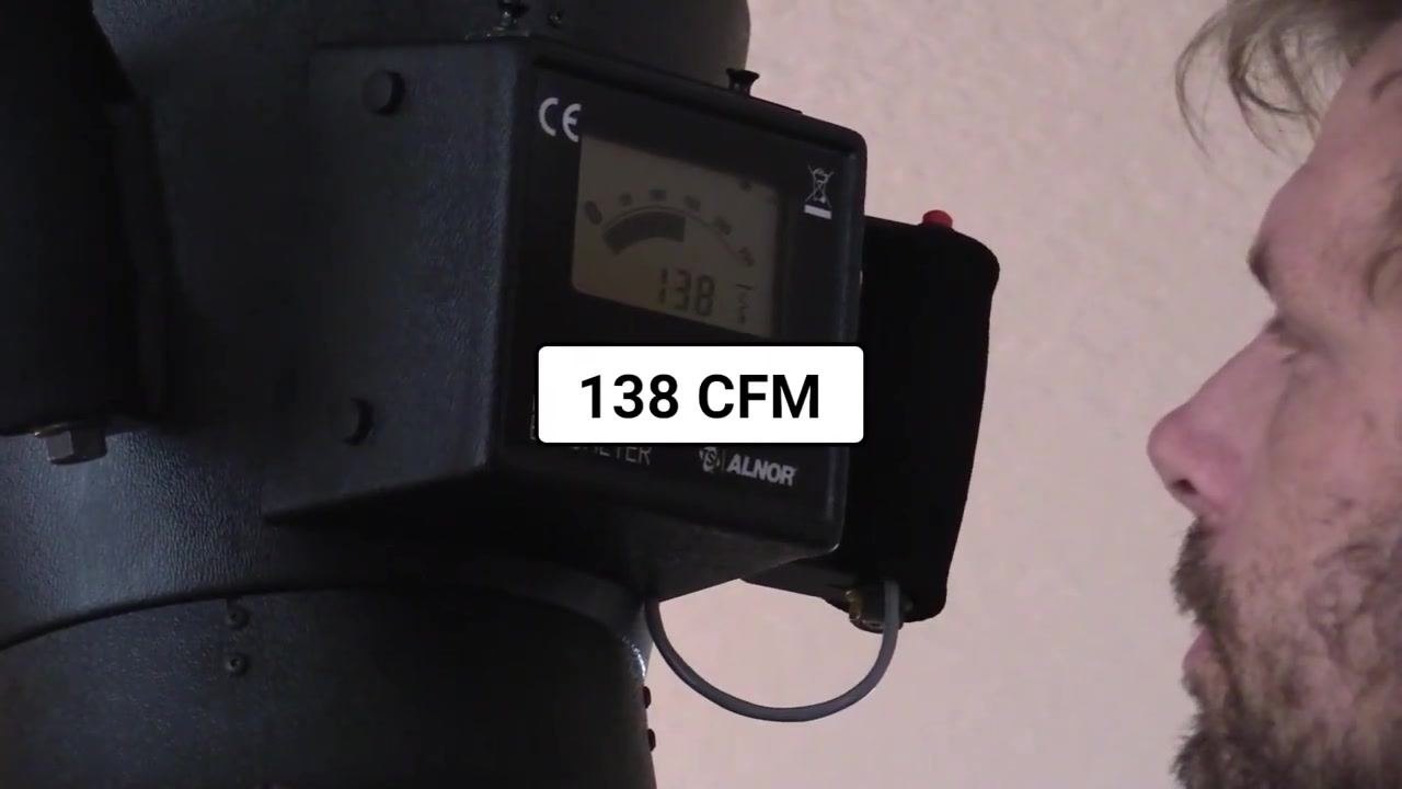 Close-up of the flow hood display showing a reading of 123 CFM.
