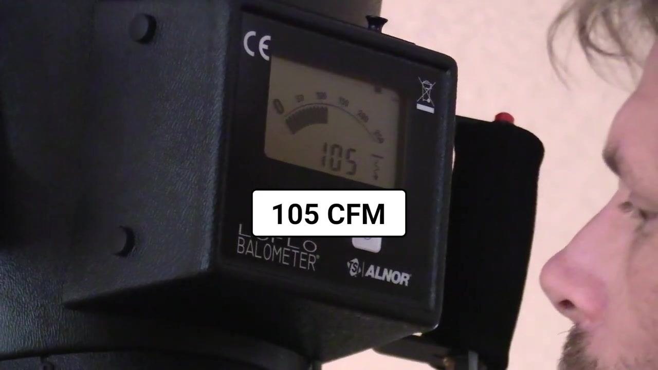 Close-up of the flow hood display showing a reading of 105 CFM.