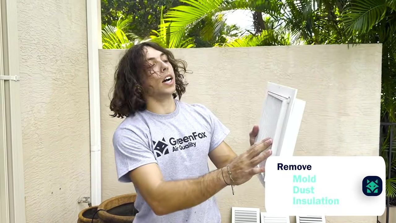 A technician displays a vent with mold, dust, and insulation removed.