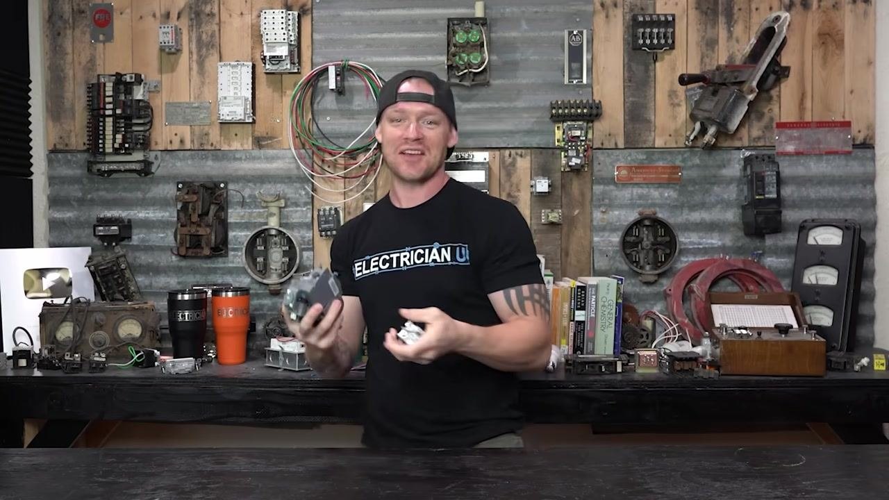 Several replacement breakers held for reference, including brands such as Federal Pacific, Zinsco, and Pushmatic