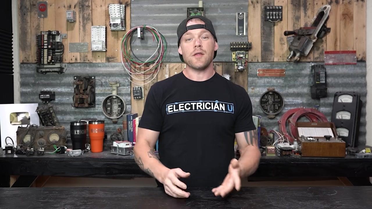 A person in a workshop, referencing specific brands (e.g., GE) that are known for handle issues, gesturing to the side.