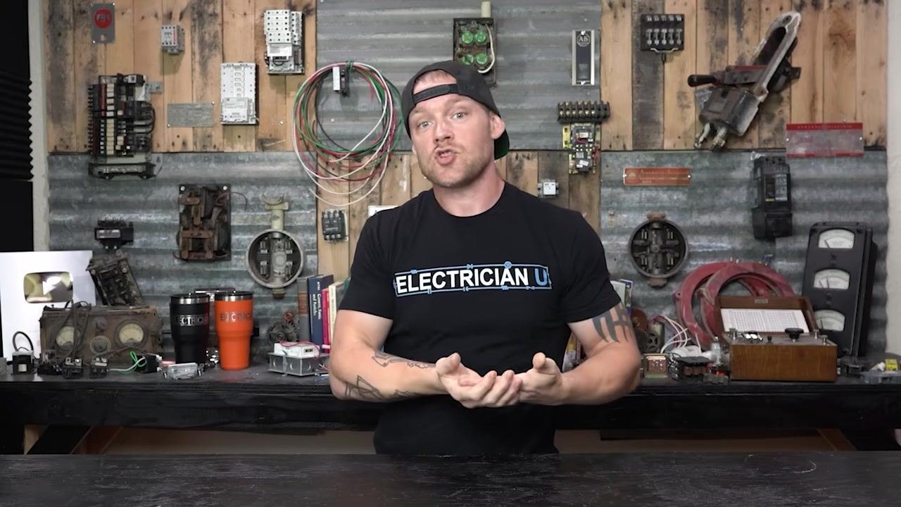 Presenter explaining the significance of finding zero volts at a breaker terminal