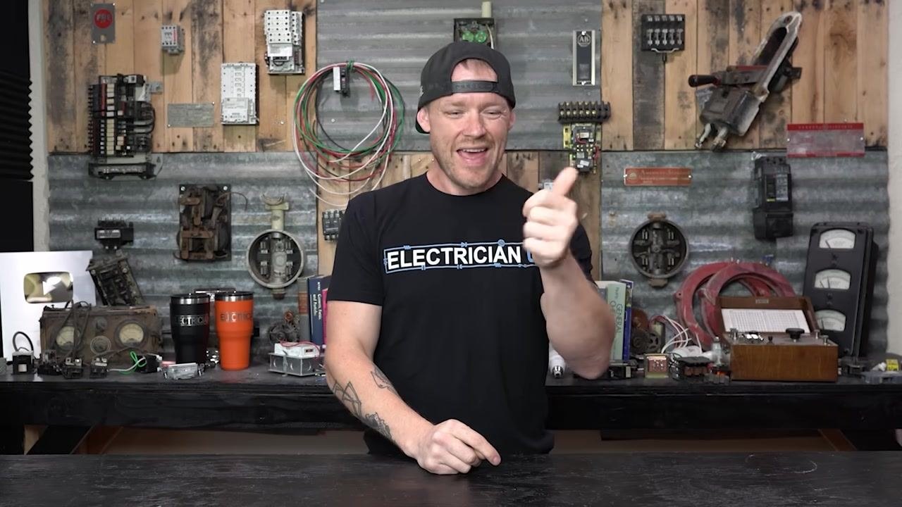 A person in a workshop, explaining the feel of a "mushy" breaker handle and its implications.