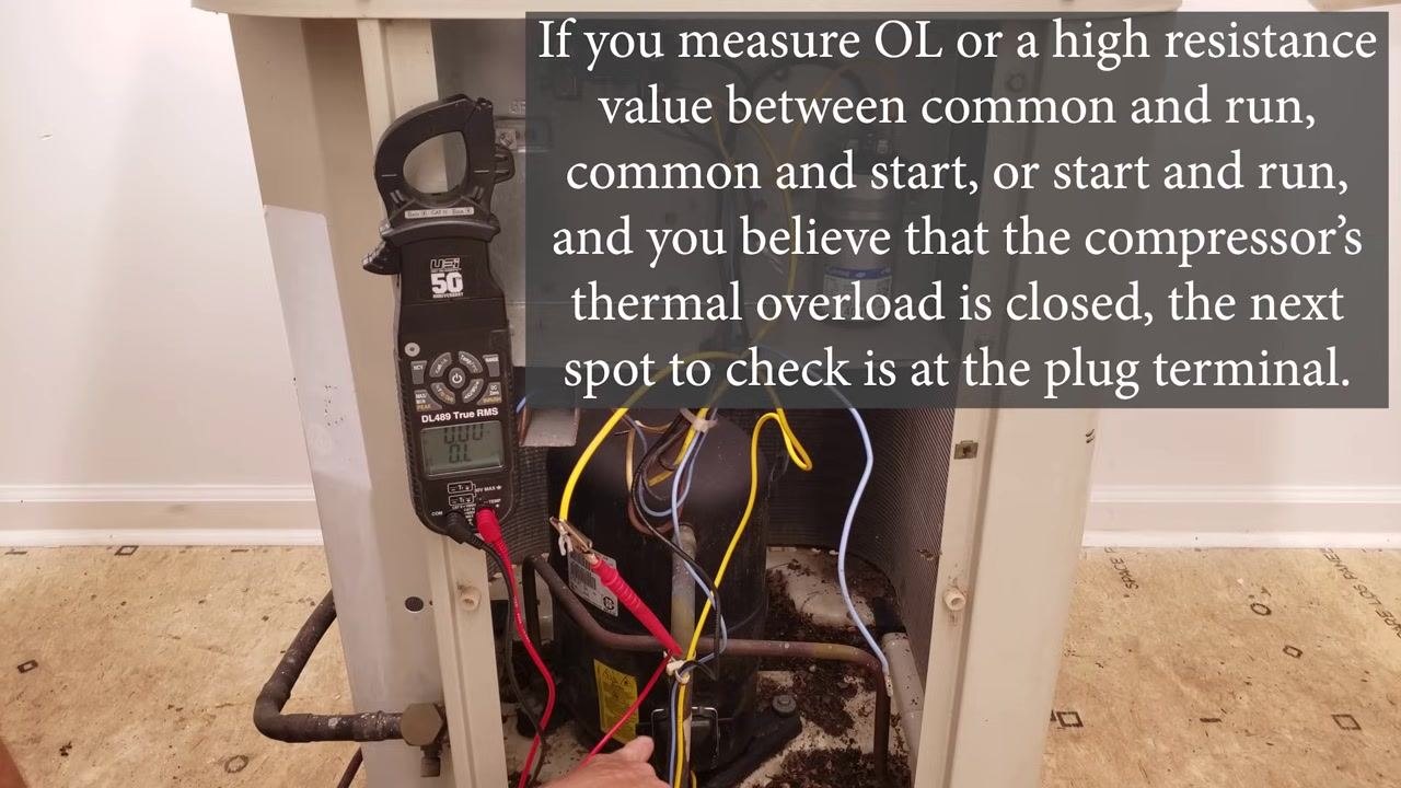 Multimeter connected to the compressor wiring with on-screen text describing the next step of checking the plug terminal