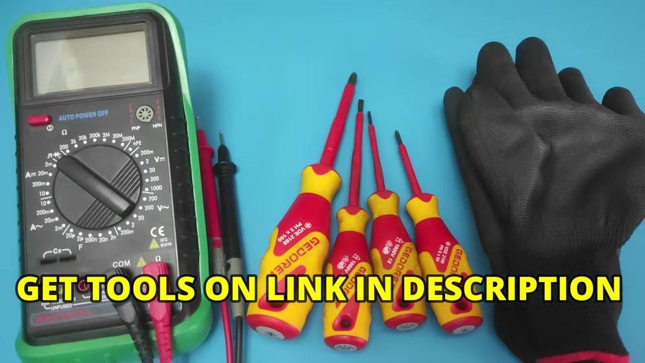 A multimeter, four insulated screwdrivers (Gedore brand), and a pair of black insulated gloves laid out on a blue surface