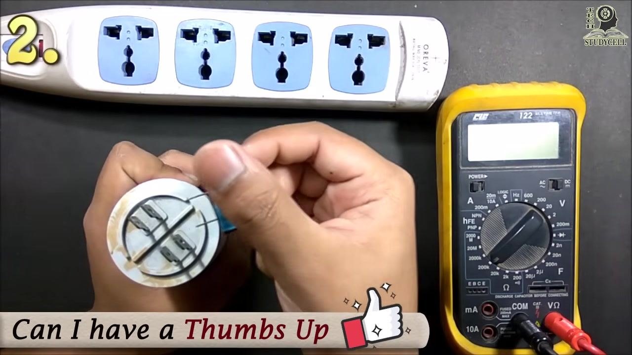 The buzzer connected across the capacitor terminals, discharging the capacitor