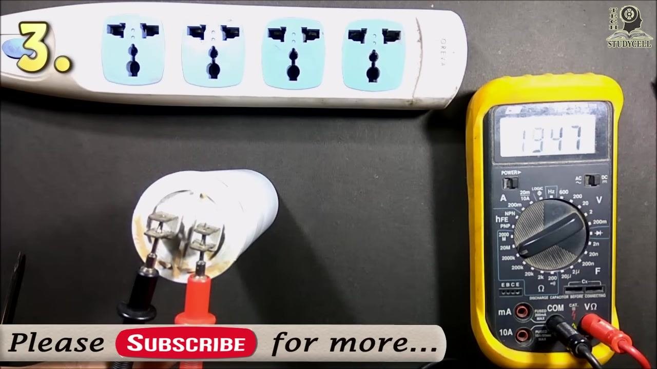 Both probes connected to the capacitor terminals, with the multimeter display showing "225"