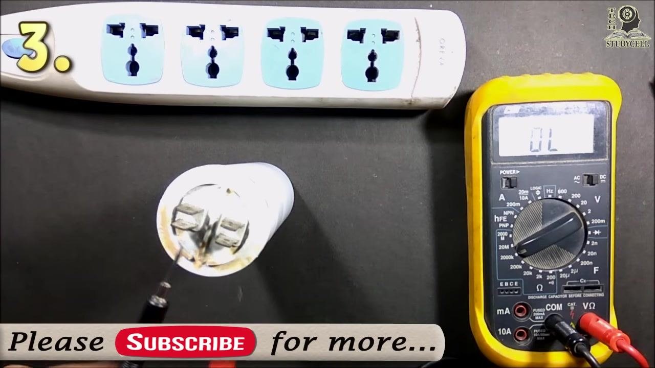The probes removed and about to be swapped, with the multimeter display reading "OL"