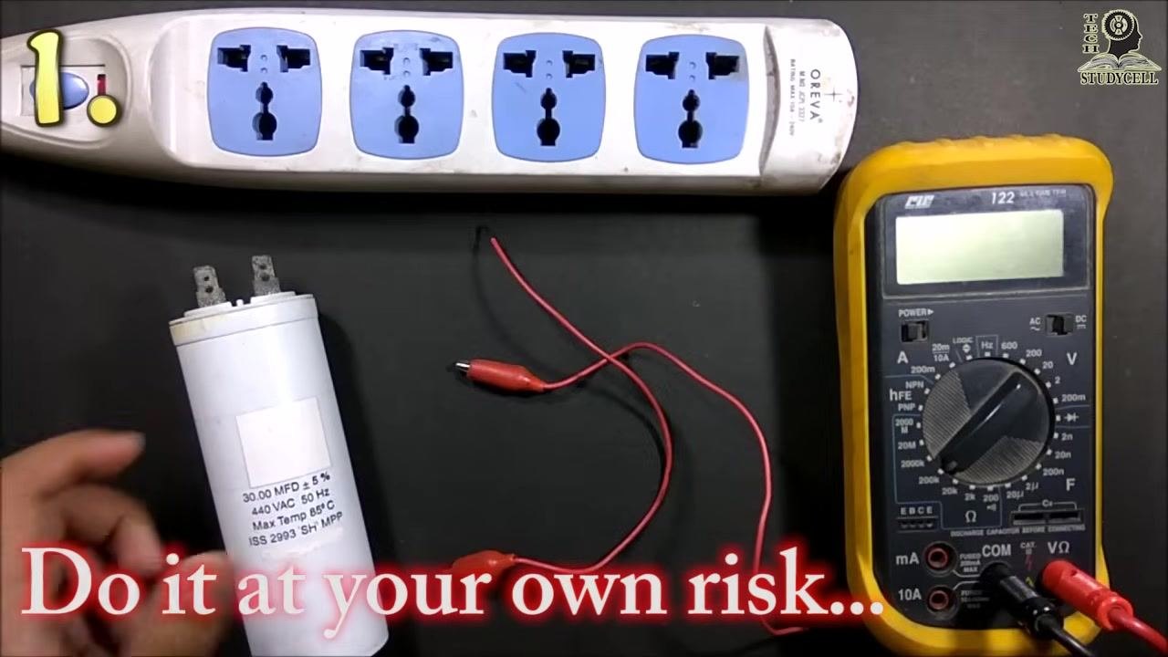 Setup for Method 1 showing the capacitor, wires, and power strip, with the red warning "Do it at your own risk"