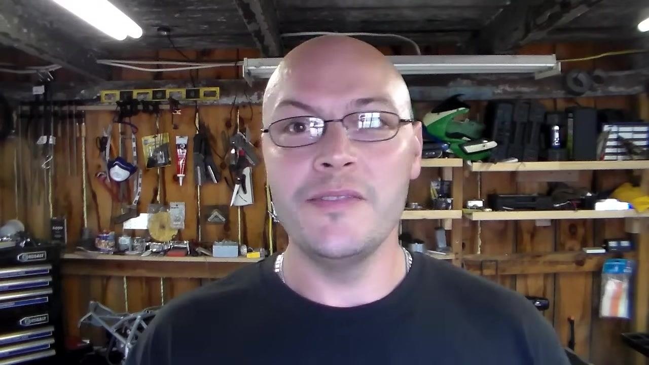 Presenter encouraging viewers to subscribe and stay connected, workshop background.