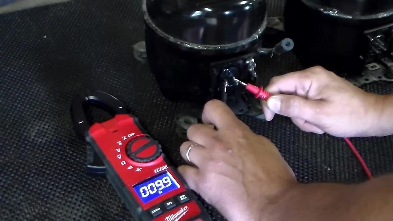 Measuring resistance from the top terminal to the right bottom terminal; multimeter displays a low reading that may fluctuate