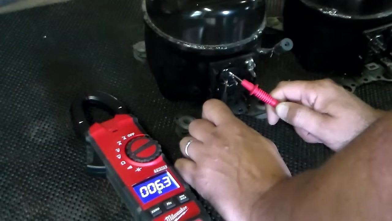 Repeating the resistance measurement from the top terminal to the bottom left terminal; multimeter displays 6.3 ohms