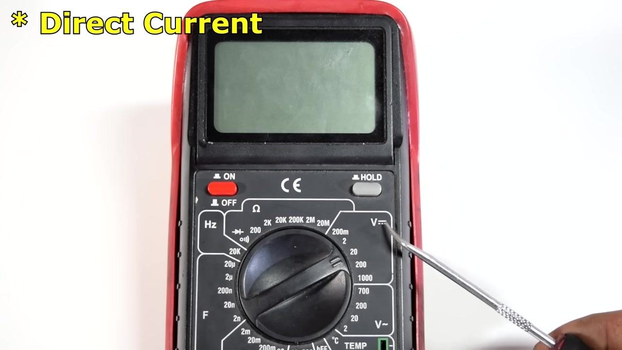 Close-up of the multimeter dial, showing the DC voltage section (V⎓) and the ON/OFF switch.