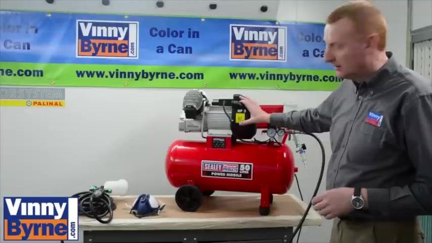 Spray gun and face mask shown together to highlight required safety equipment