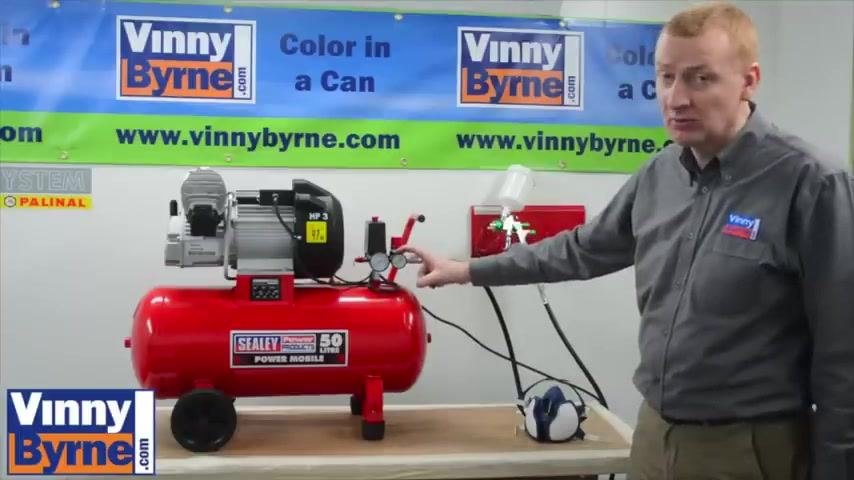 Regulator gauge being adjusted to set the air pressure