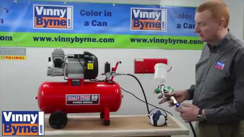 Spray gun connected to the compressor and ready for use