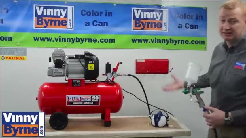 Compressor and spray gun setup with all equipment visible