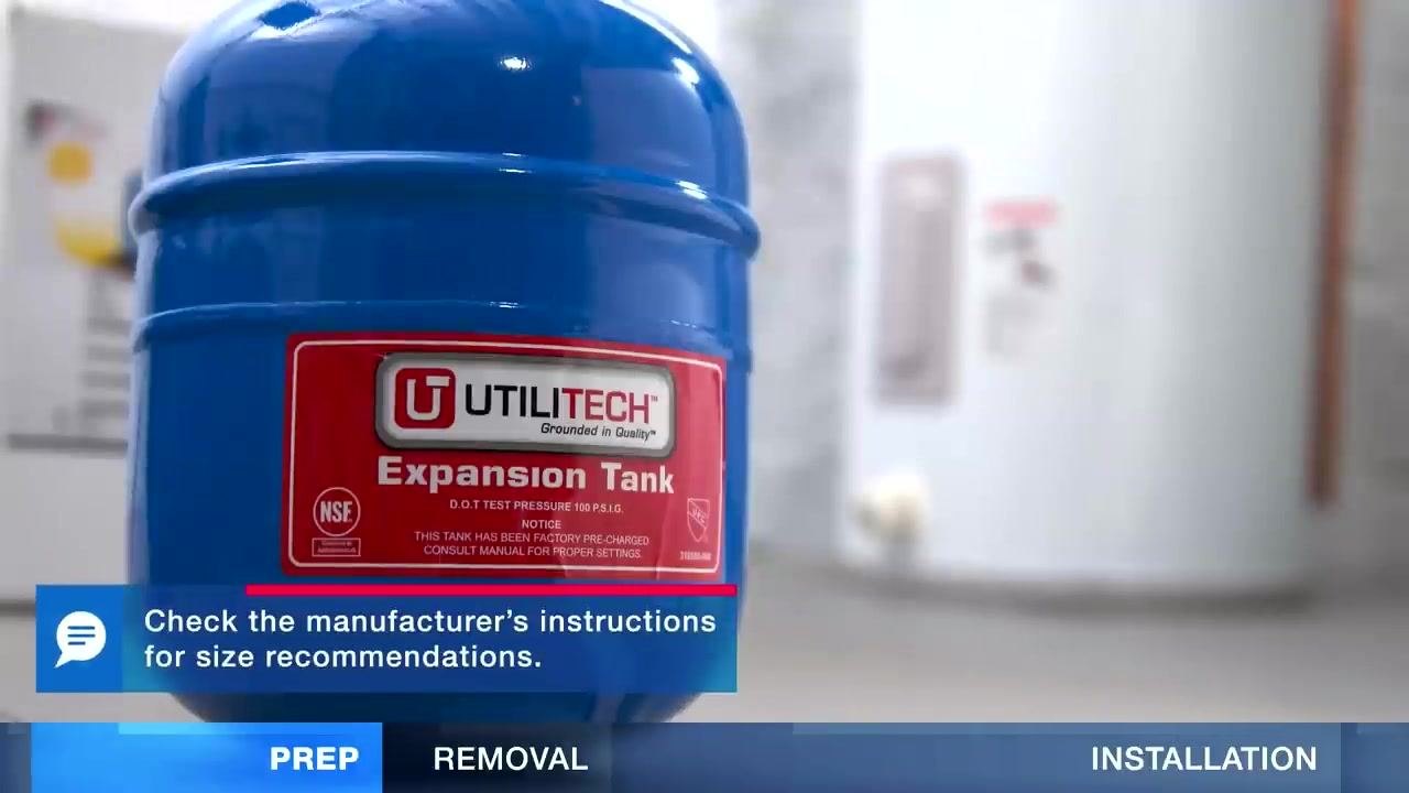 A blue expansion tank with a clear label, placed in a utility room, with a note to check the manufacturer's instructions for size recommendations.