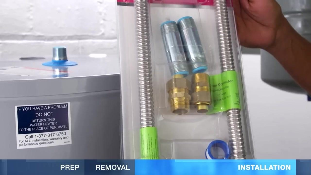 Close-up of the flexible hose kit showing the plumber's tape and connectors, with the top of the new water heater visible.