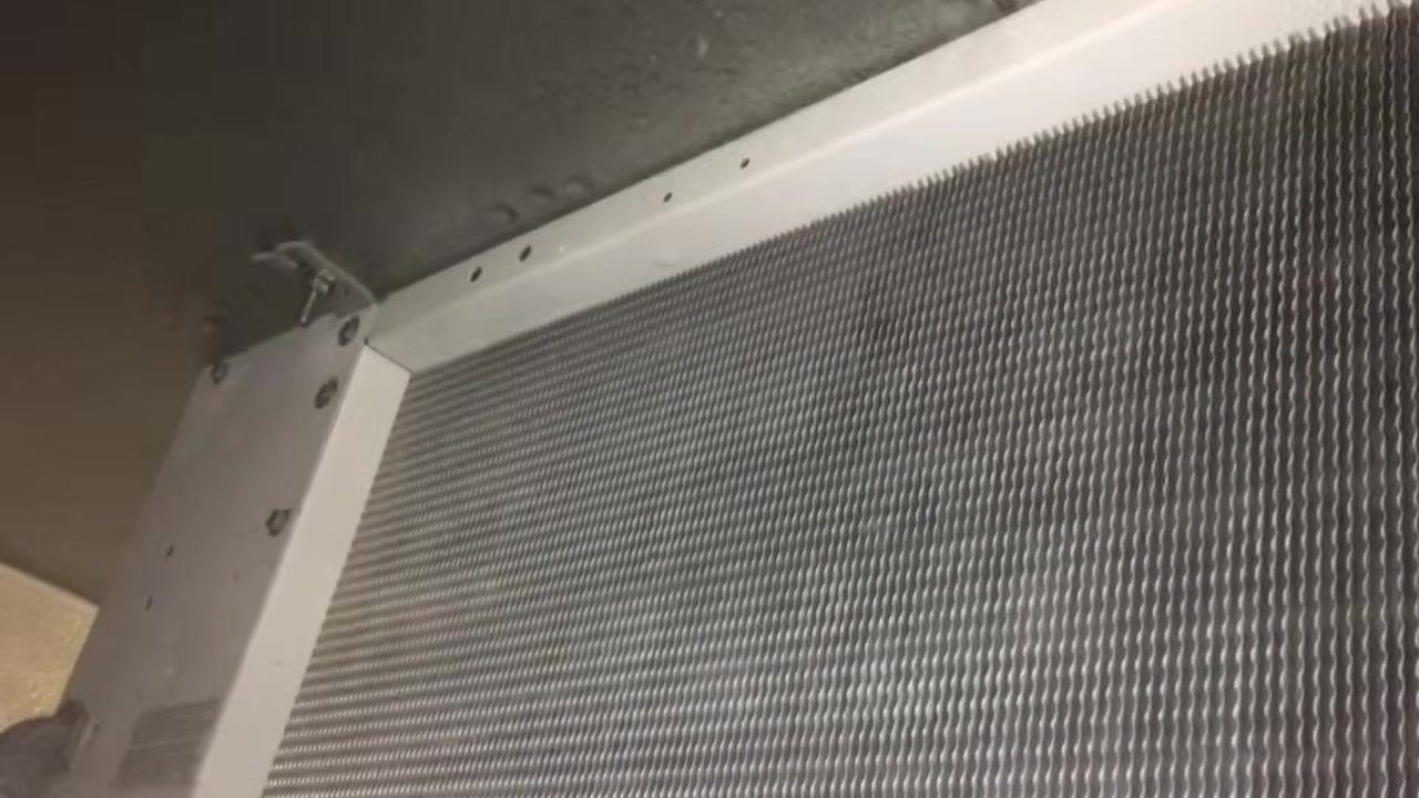 Close-up of clean HVAC coil fins and white frame