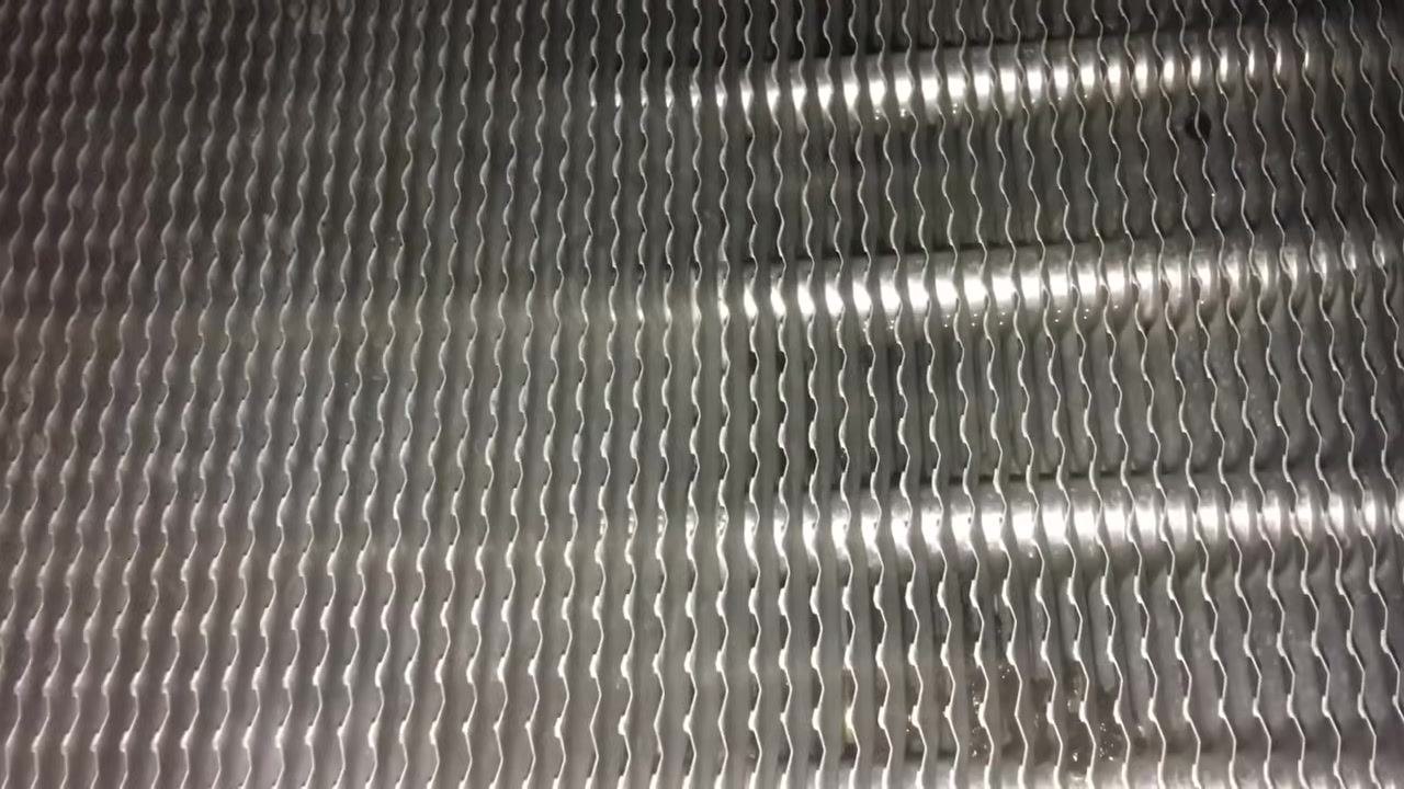 Heat exchanger tubes viewed from a different angle, still clean and metallic