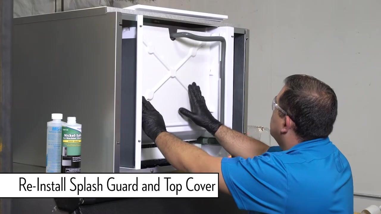 Technician pressing the clean button to complete the descaling process.