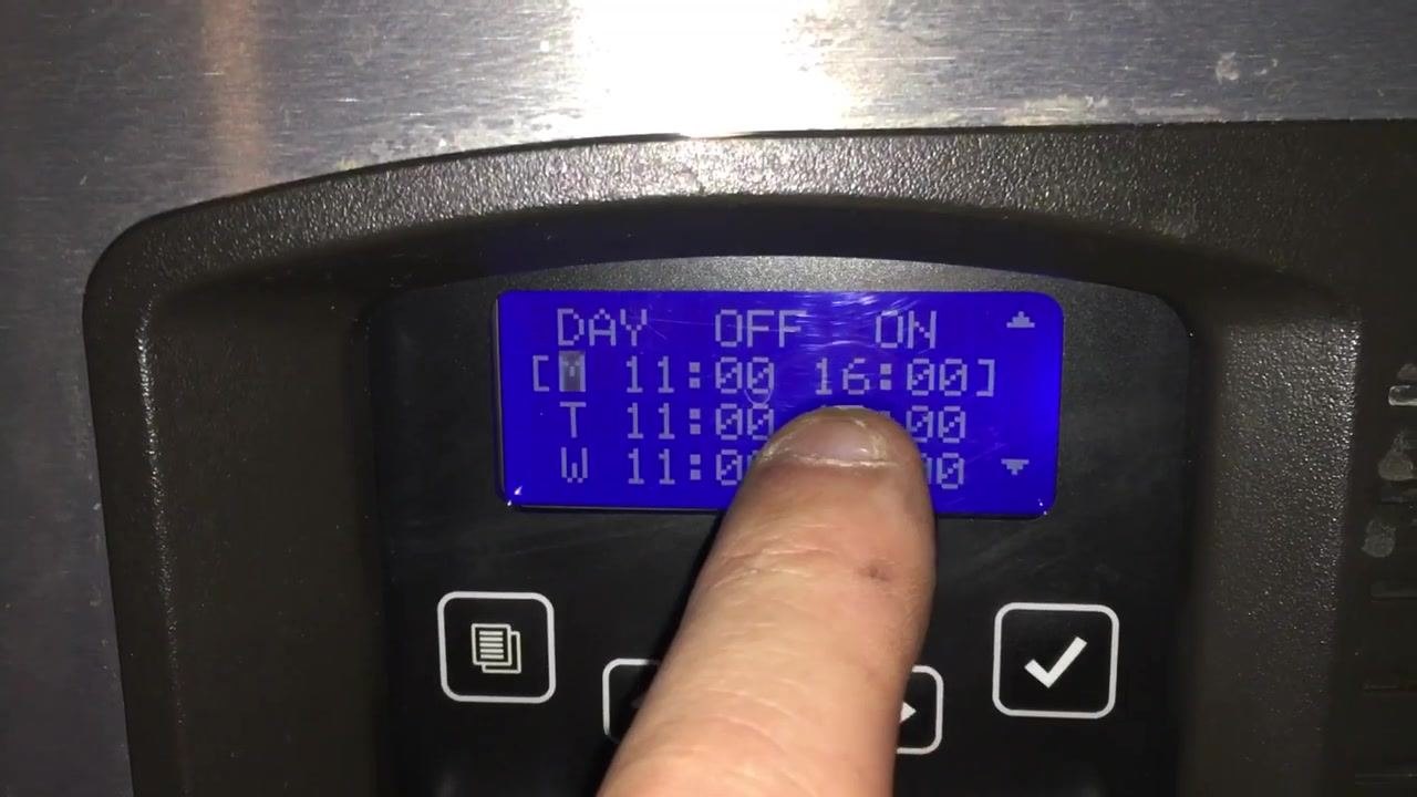 Finger pointing at Monday's OFF and ON times, ready for adjustment