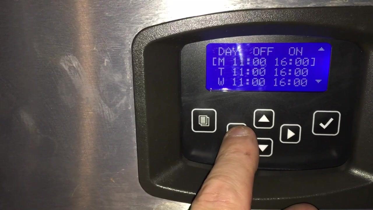 Finger adjusting Monday's OFF time to 1:00 AM on the schedule screen