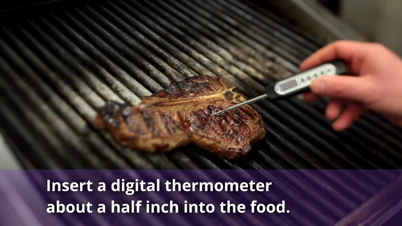 Digital thermometer inserted about a half inch into a steak on a grill, with text noting that a digital thermometer should go about a half inch into the food.