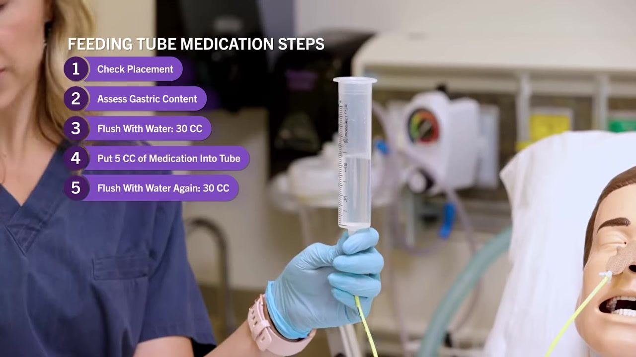 Close-up of nurse holding a syringe with water, with on-screen text now showing steps for "Put 5 CC of Medication Into Tube" and "Flush With Water Again: 30 CC."