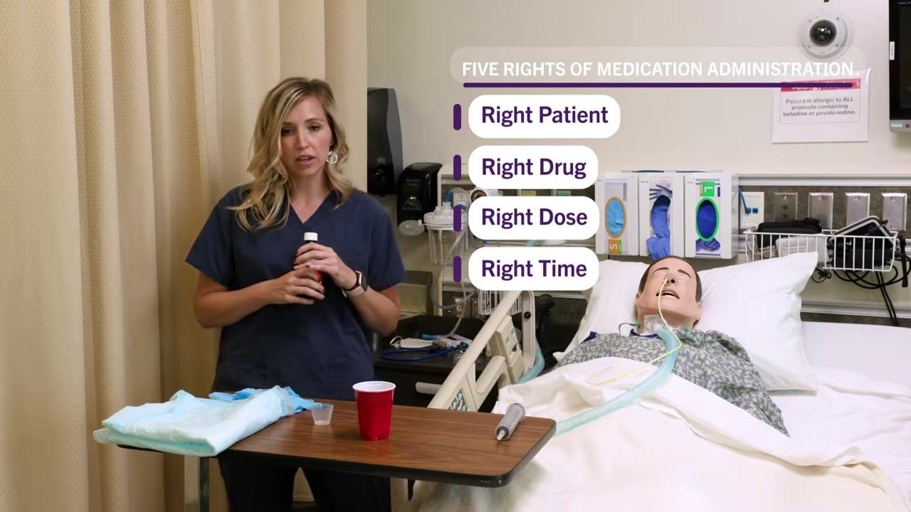 Nurse standing beside a patient's hospital bed, holding a medication bottle, with on-screen text listing the Five Rights of Medication Administration: right patient, right drug, right dose, right time. Supplies including a medication cup, water cup, and absorbent pad are on the table, with an allergy alert sign visible in the background.