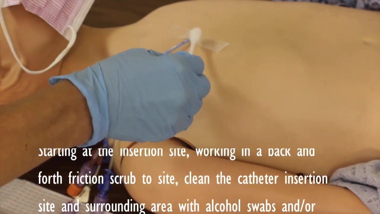 Hands placing a new bio patch onto the sterile field, next to the opened kit and a mask.