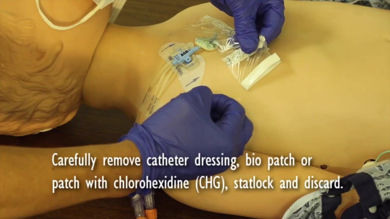 Gloves being removed with the mannequin's central line exposed; on-screen guidance instructs to remove gloves, wash hands, and open the sterile kit to create a sterile field.