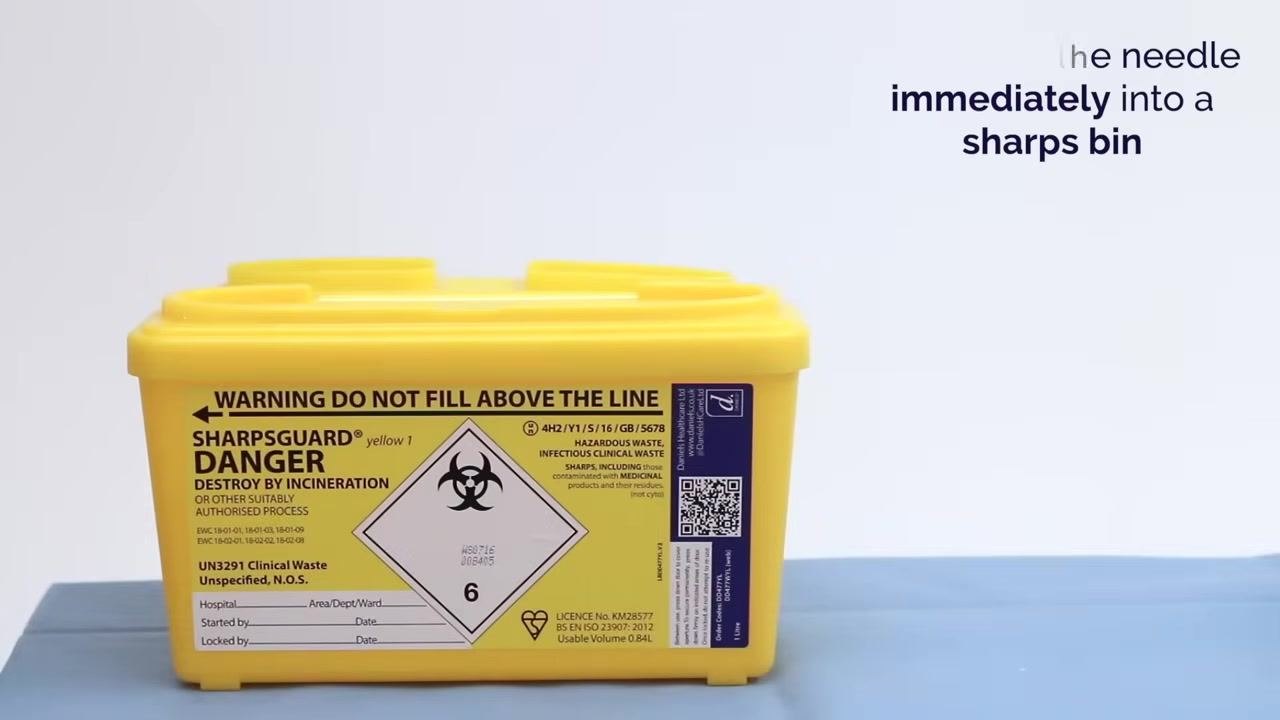 Used gloves, gauze, and wipes placed into a clinical waste bin