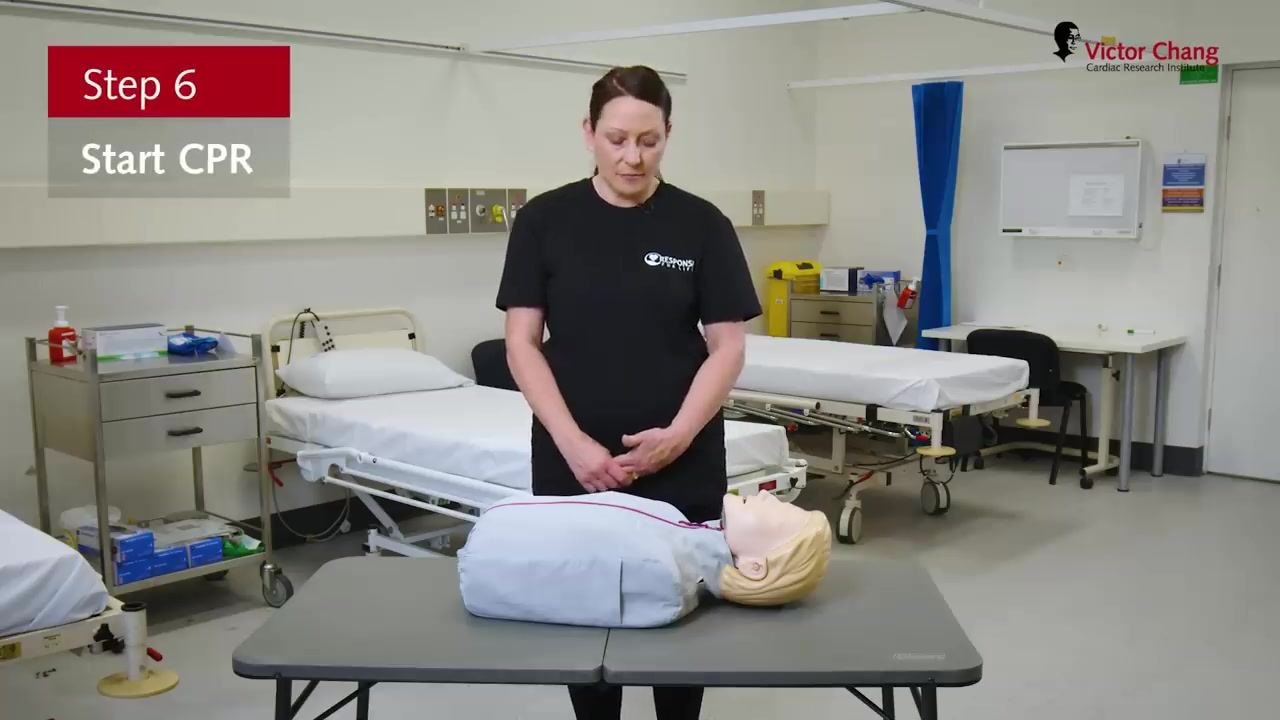 Standing beside a manikin, with on-screen text "Step 6: Start CPR."
