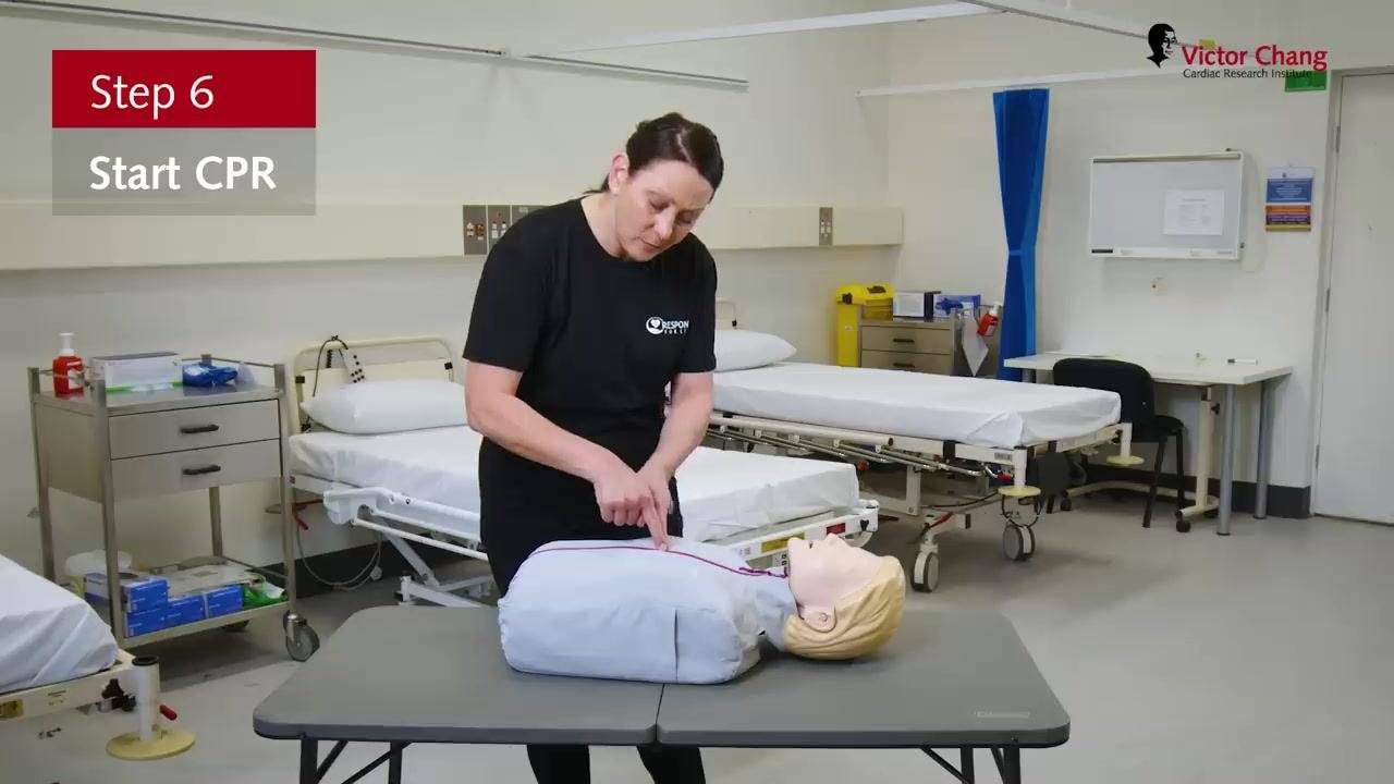 Demonstration of locating the correct hand position for chest compressions on a manikin, with on-screen text "Step 6: Start CPR."