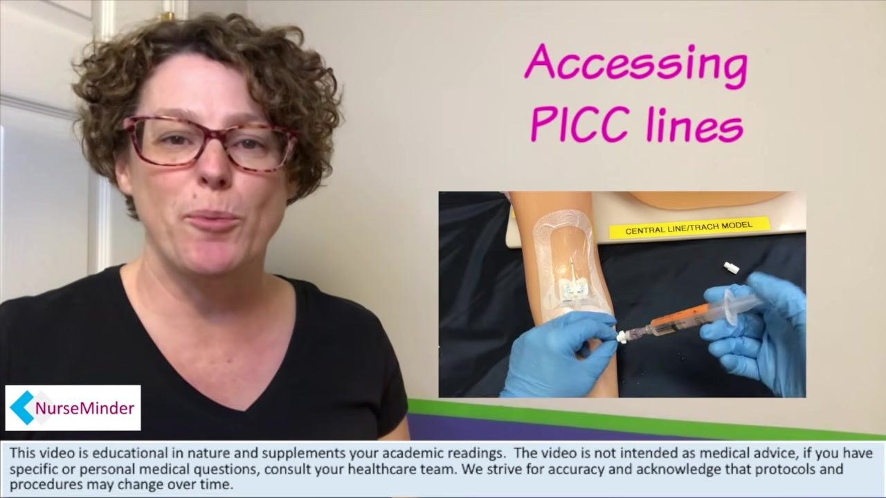 A training arm labeled "Central Line/Trach Model" with a PICC line in place and a packaged saline flush syringe positioned nearby