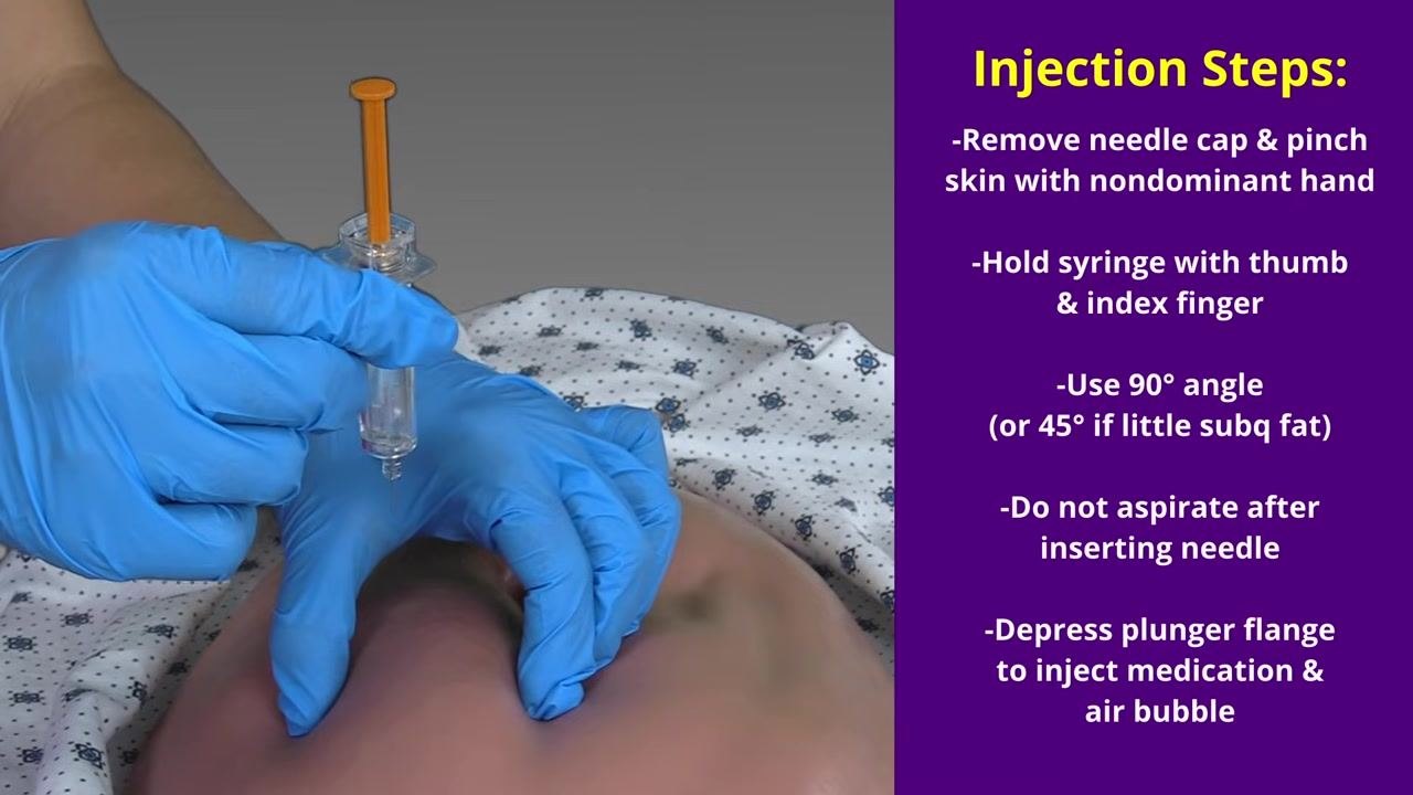 Gloved hand pinching and lifting a skinfold of fatty tissue on the abdomen in preparation for injection.