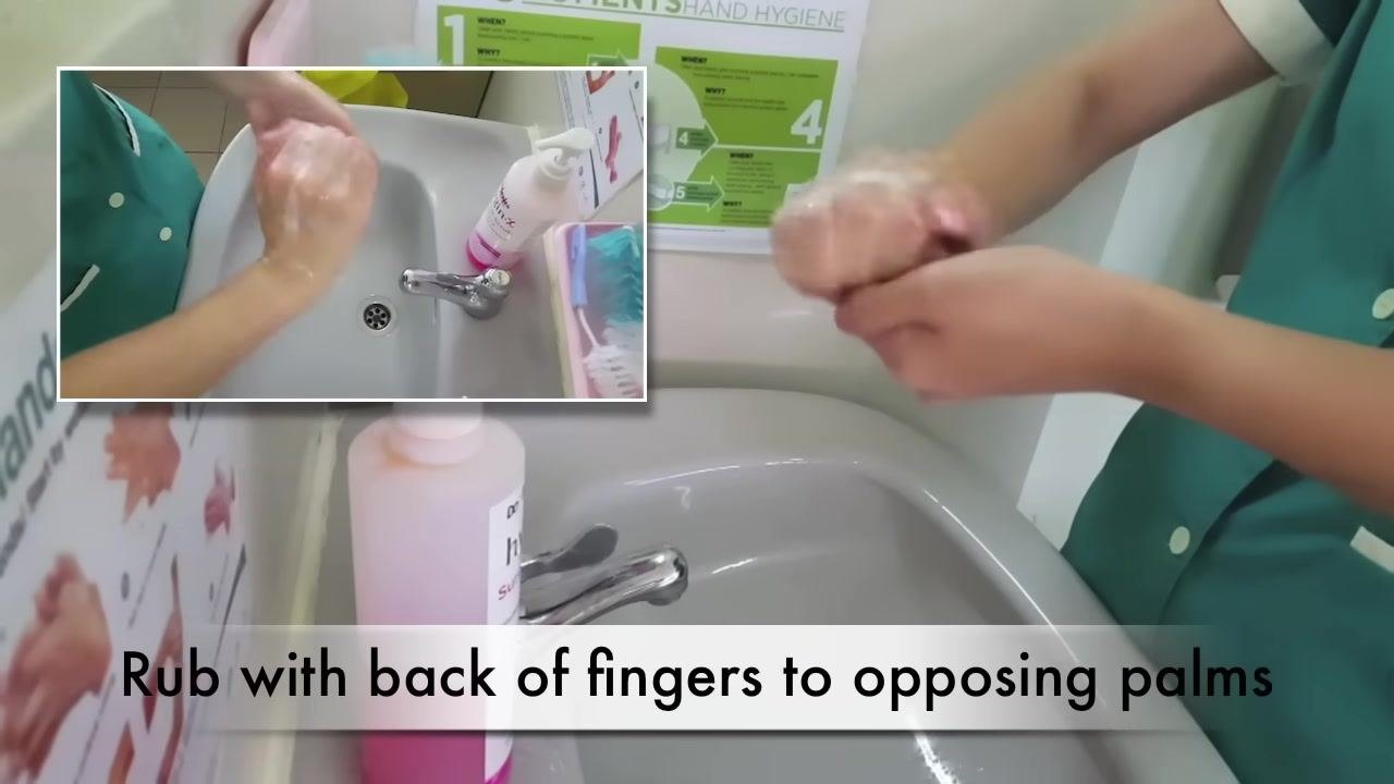 A person rubs the tips of their fingers in the opposite palm over a sink. The caption reads "Rub tips of fingers in opposite palm."