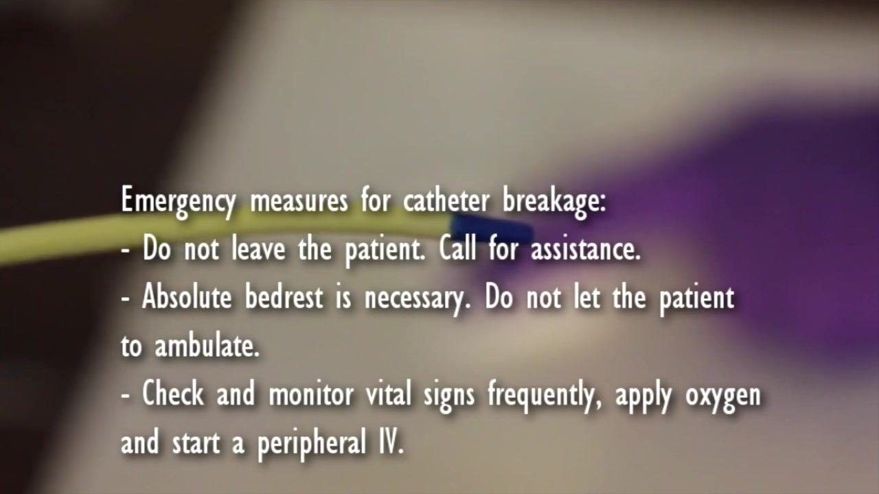 Close-up of a catheter with on-screen guidance listing emergency measures: do not leave the patient, call for assistance, enforce bed rest, monitor vitals, apply oxygen, and start a peripheral IV.