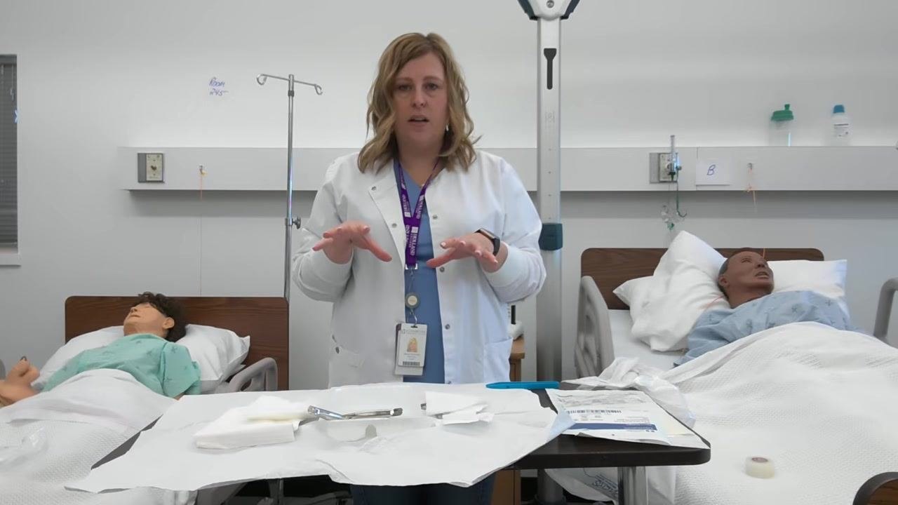 A healthcare professional gestures over the sterile field, emphasizing that only necessary items should be placed on it.