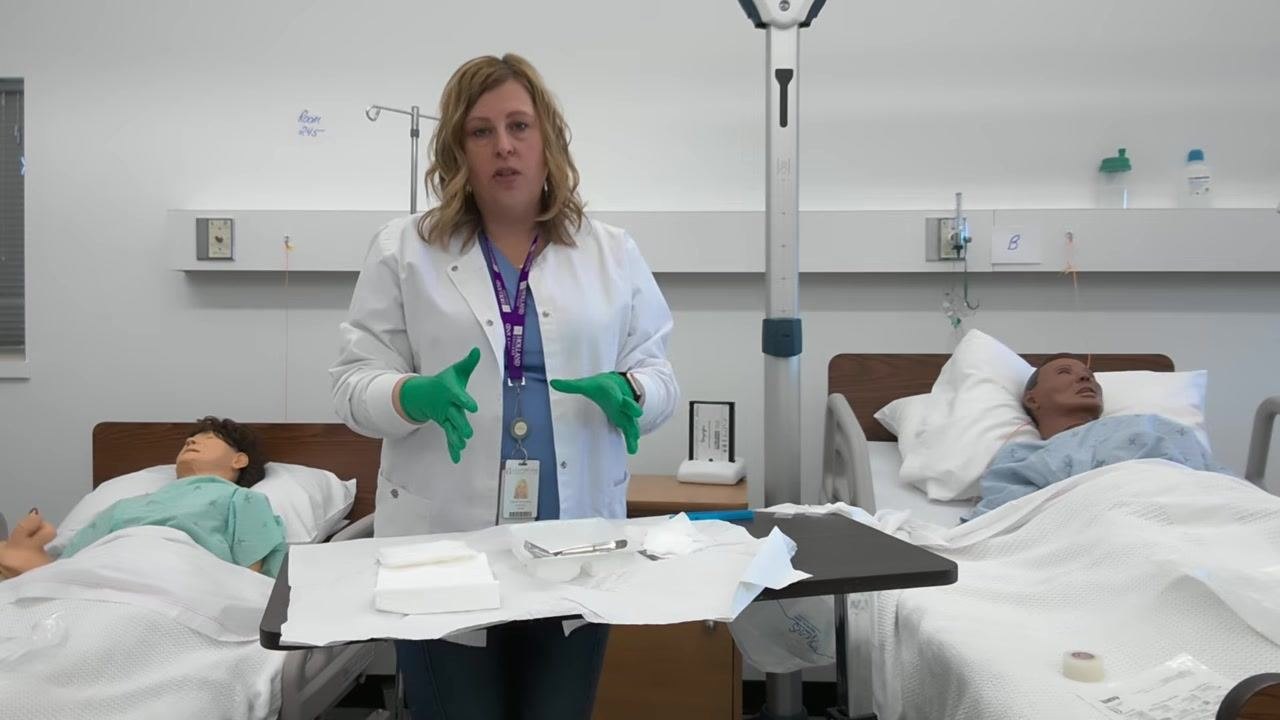 A healthcare professional demonstrates the correct placement of clean items on the sterile tray, with gloved hands and organized supplies.
