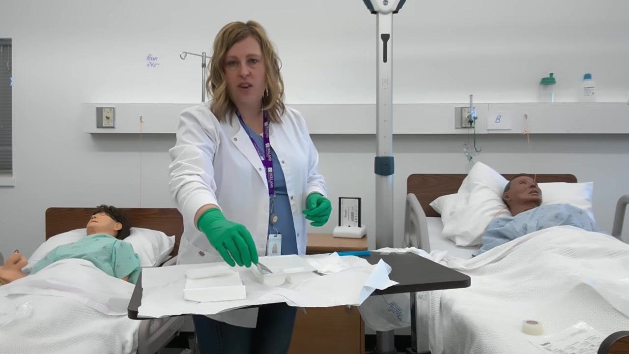 A healthcare professional organizes the tray, ensuring only clean supplies remain, with gauze and forceps neatly arranged.